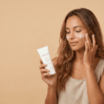 a girl using sunscreen