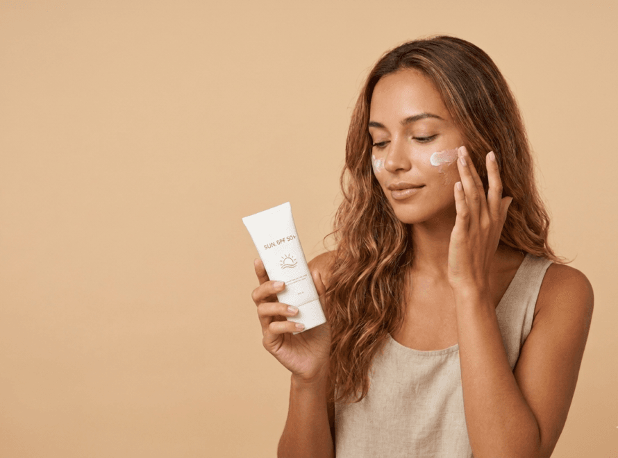 a girl using sunscreen